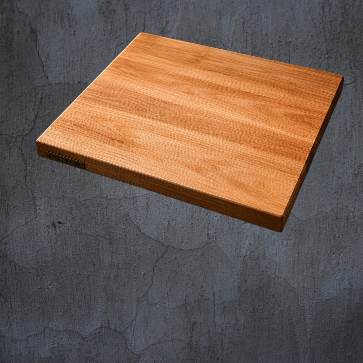 Wooden cutting board on a stone surface with additional views and product details.