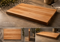 Wooden cutting board on a rustic surface with additional views and dimensions displayed.