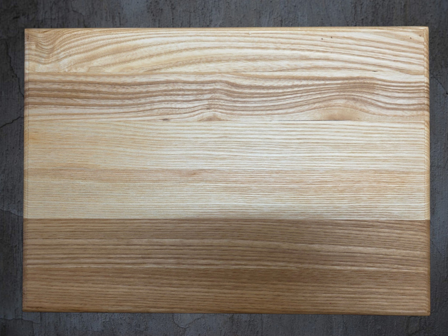 Ash chopping board with rounded edge used for serving bread and cheese