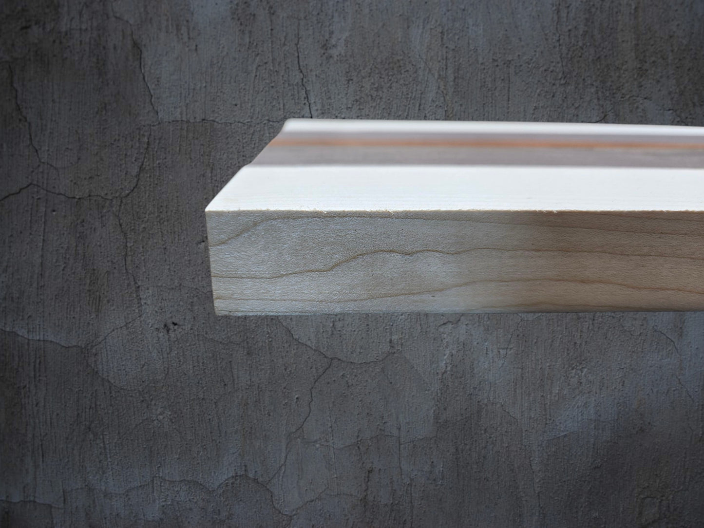 Ash walnut and pink ivory wooden cheese board displayed in kitchen setting