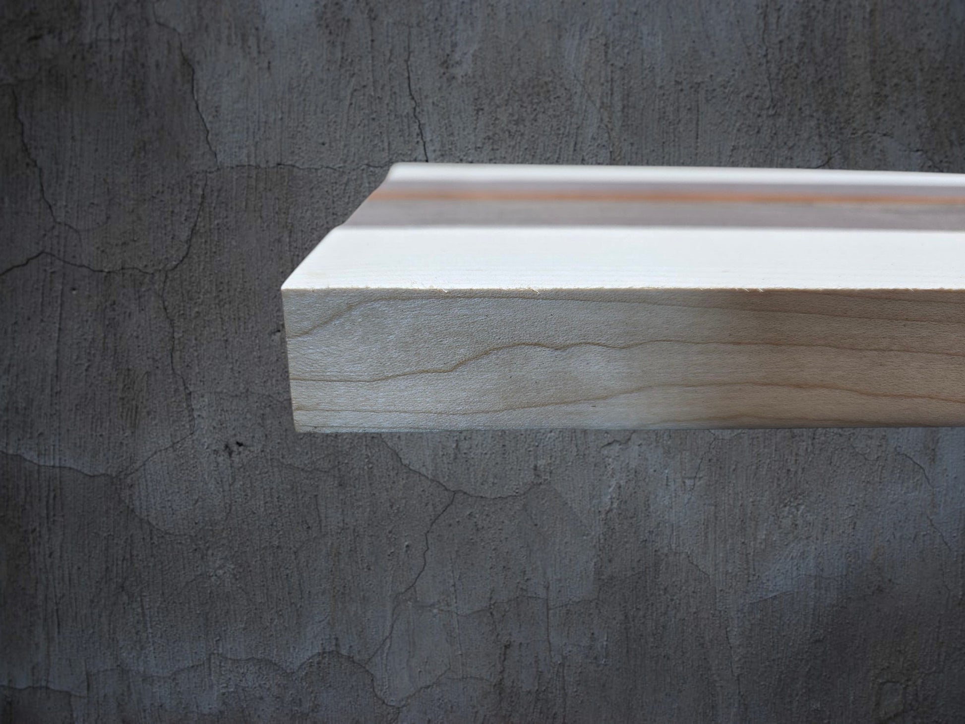 Ash walnut and pink ivory wooden cheese board displayed in kitchen setting