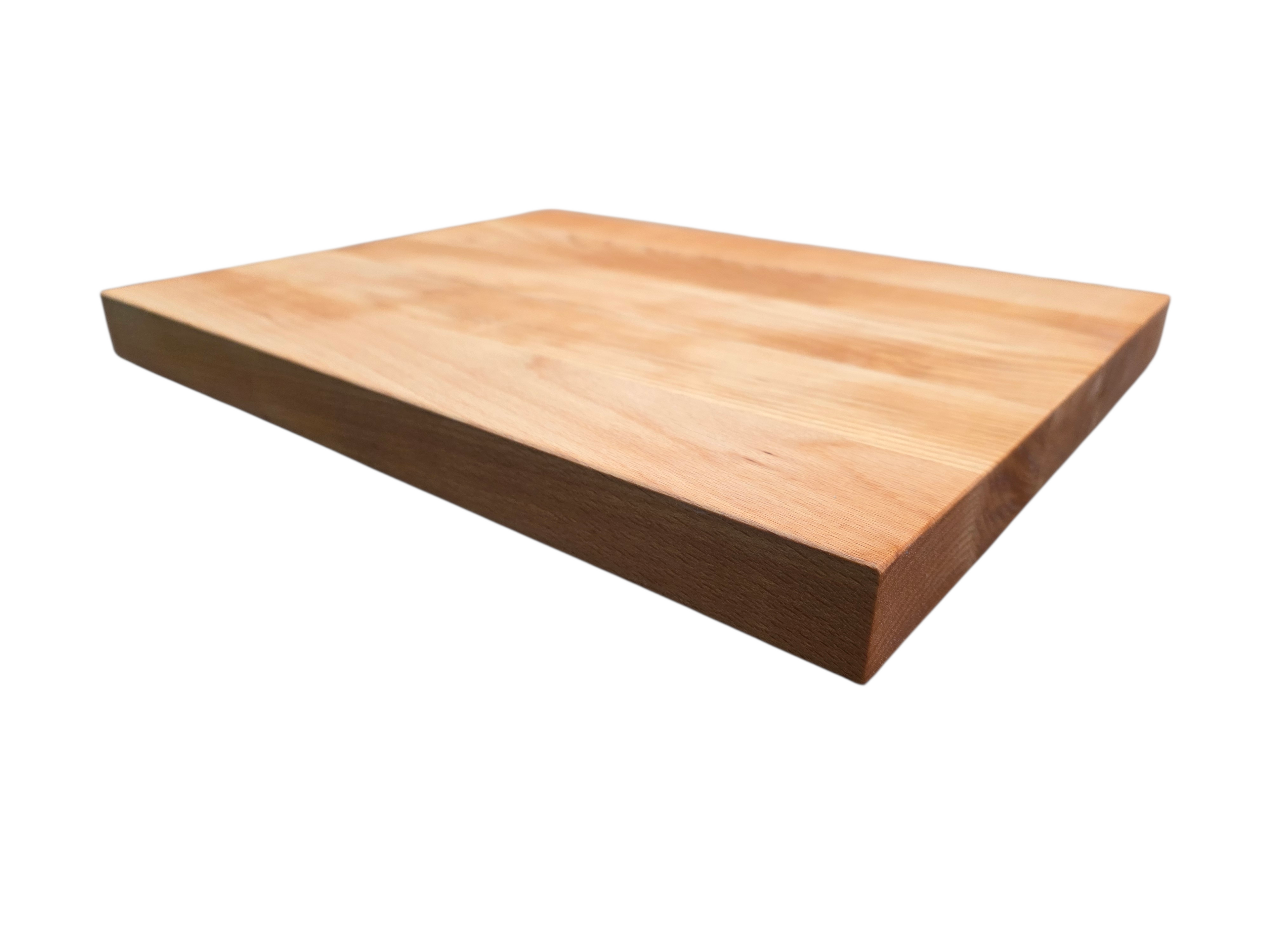 Solid ash chopping board close-up showing detailed pale wood grain