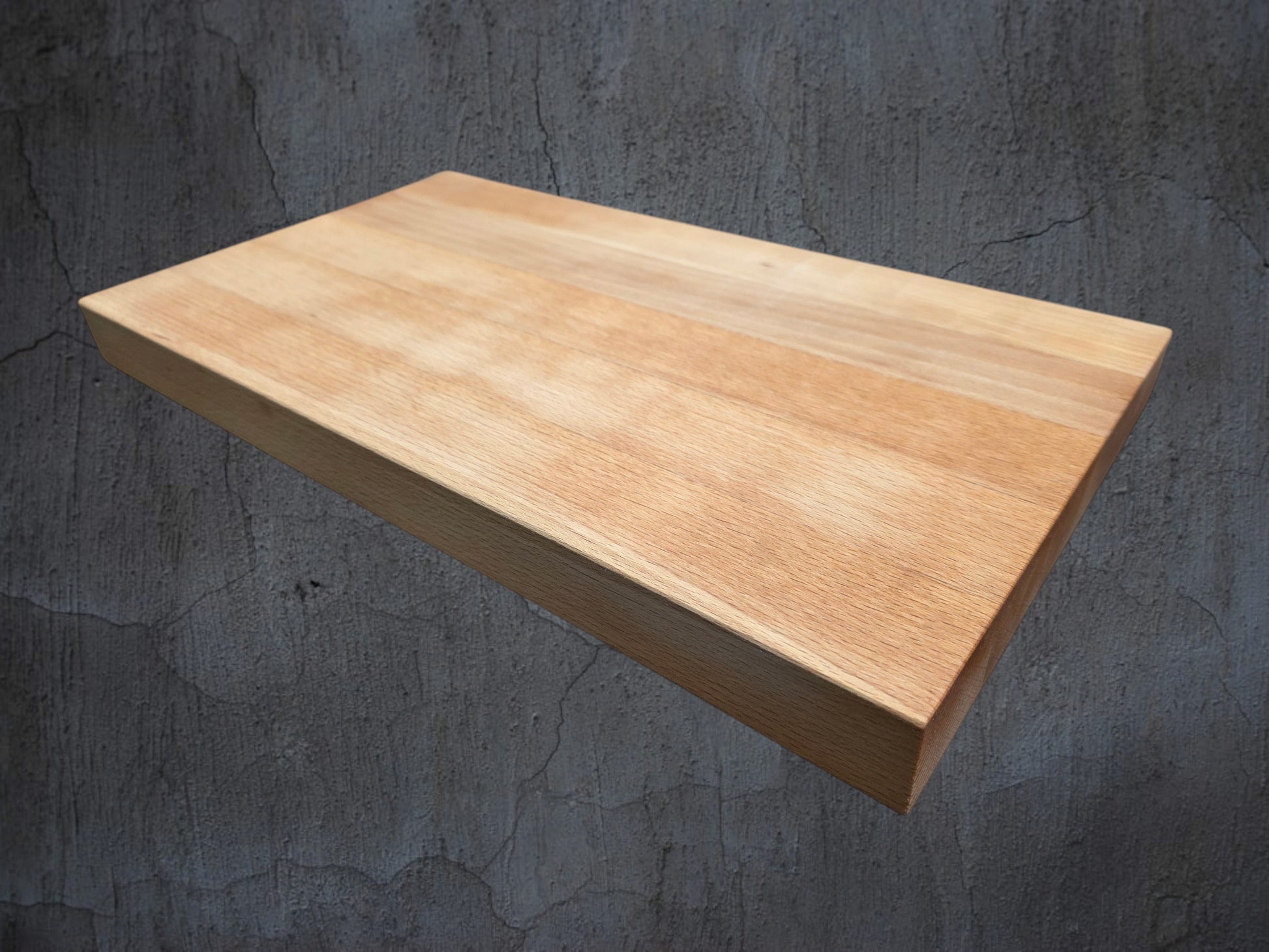 Close up of hardwood chopping boards and kitchen accessories in starter bundle