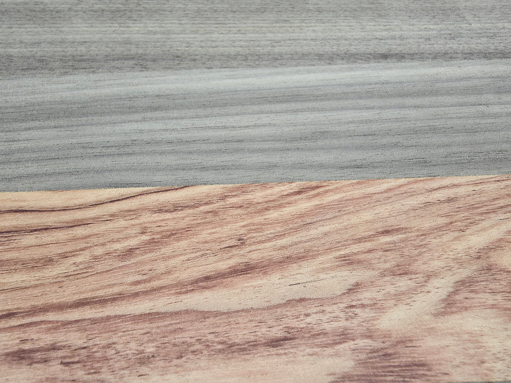 Close up of walnut and pink ivory wood grain on luxury chopping board
