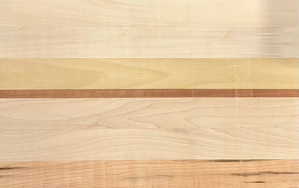 Close up of oak and walnut wood grain on premium cheese board