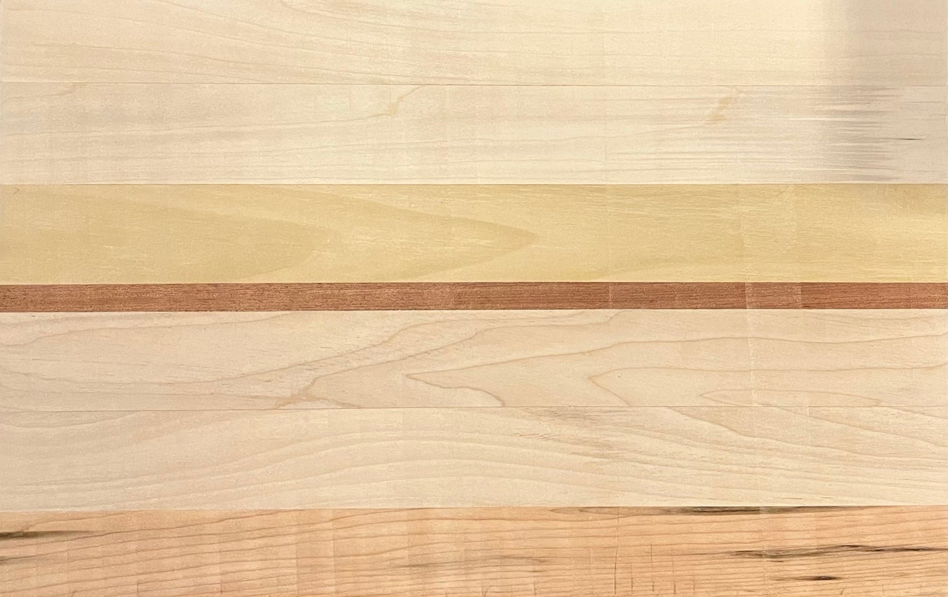 Close up of oak and walnut wood grain on premium cheese board