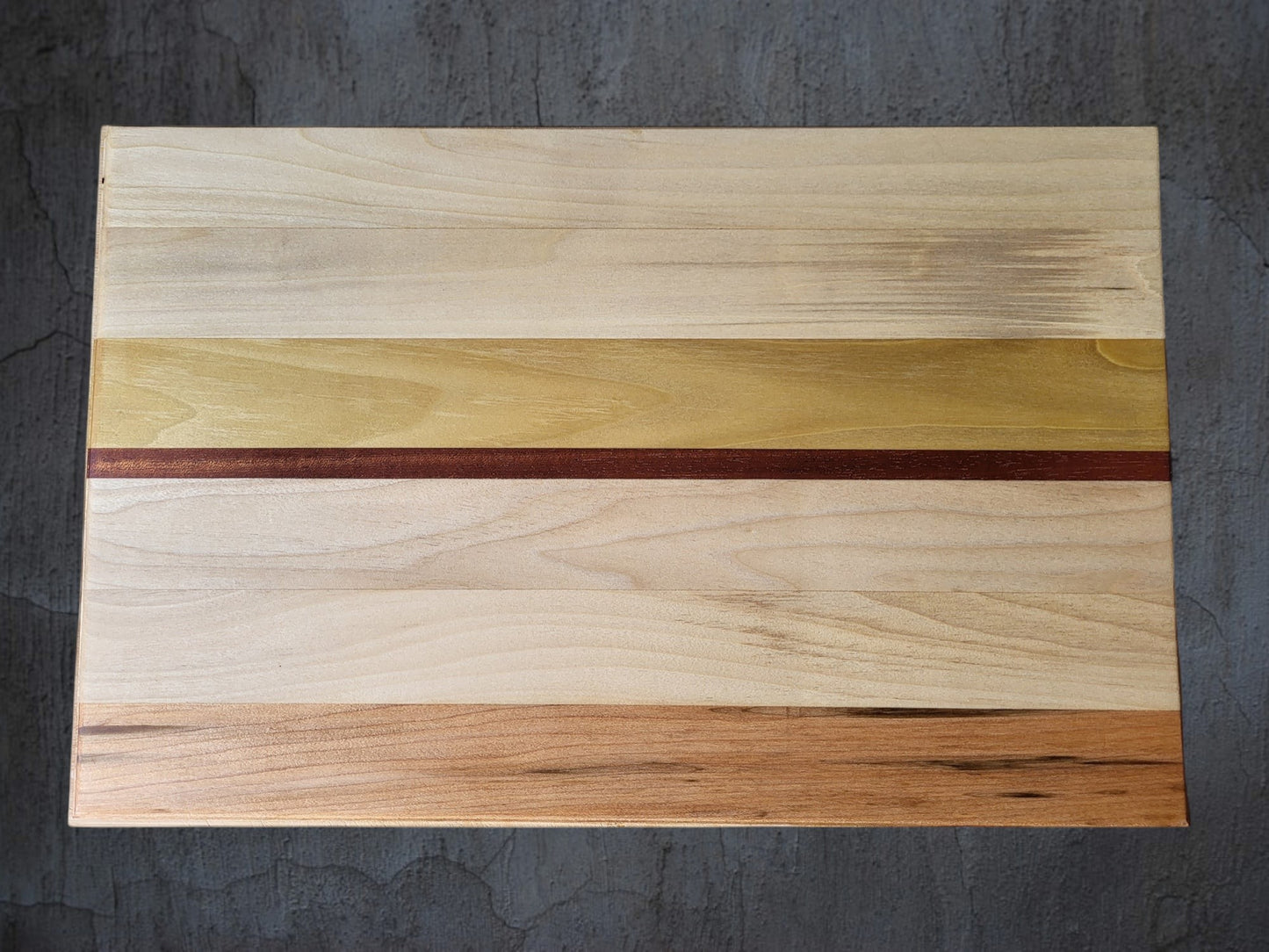 Oak and walnut premium cheese board serving cheese and charcuterie