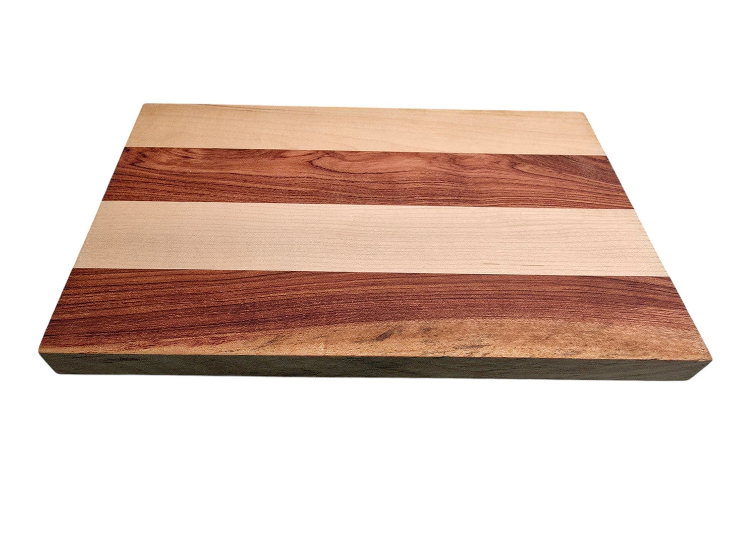 Pink ivory and ash cheese board used for serving cheese and charcuterie