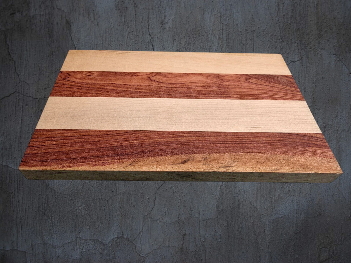 Pink ivory and ash cheese board used for serving cheese and charcuterie
