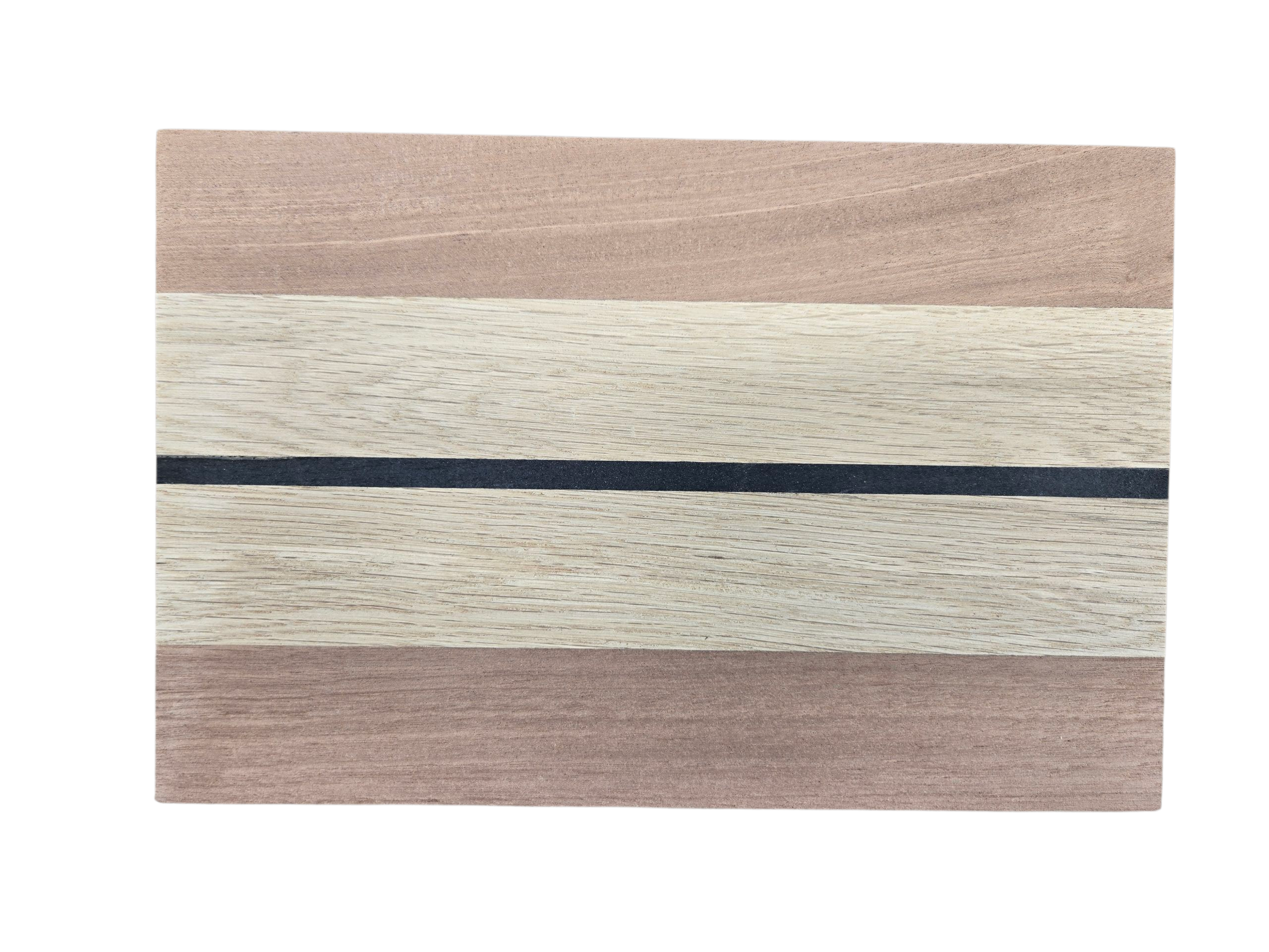 Close up of walnut oak and ebony wood grain on cheese board