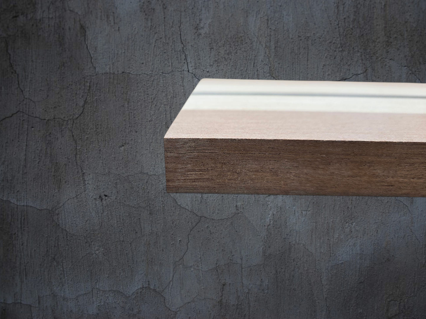 Walnut oak and ebony wooden cheese board displayed in kitchen setting