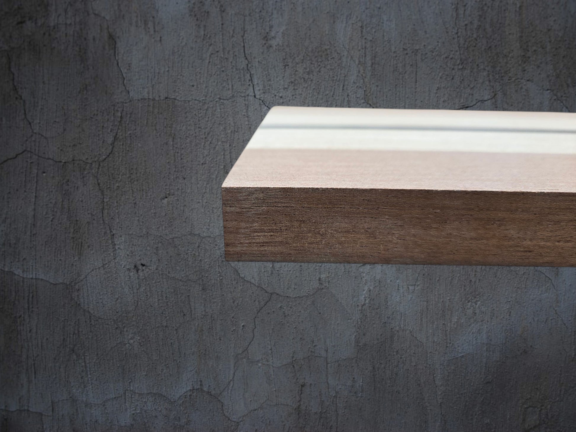 Walnut oak and ebony wooden cheese board displayed in kitchen setting