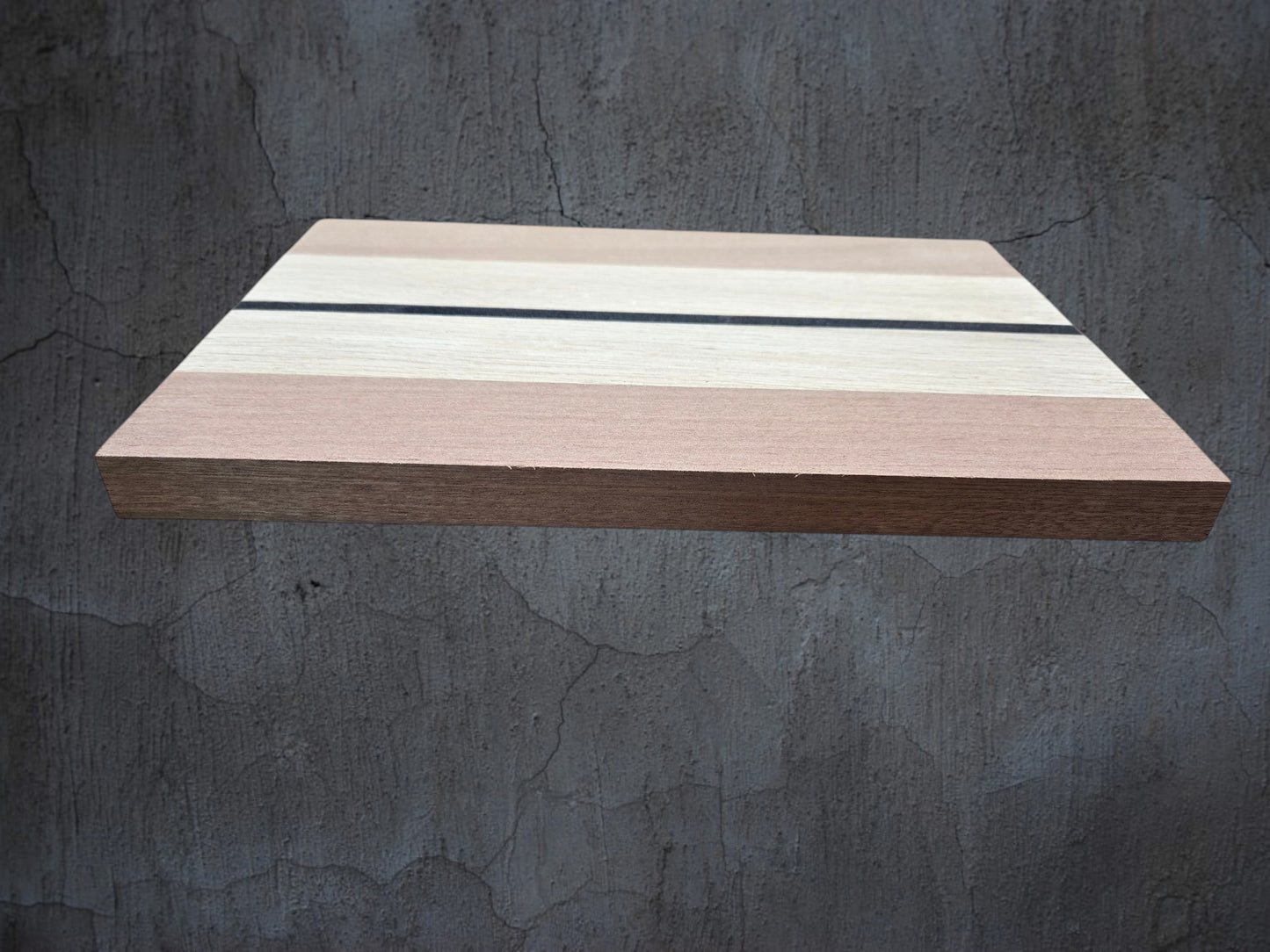 Walnut oak and ebony cheese board used for serving cheese and charcuterie