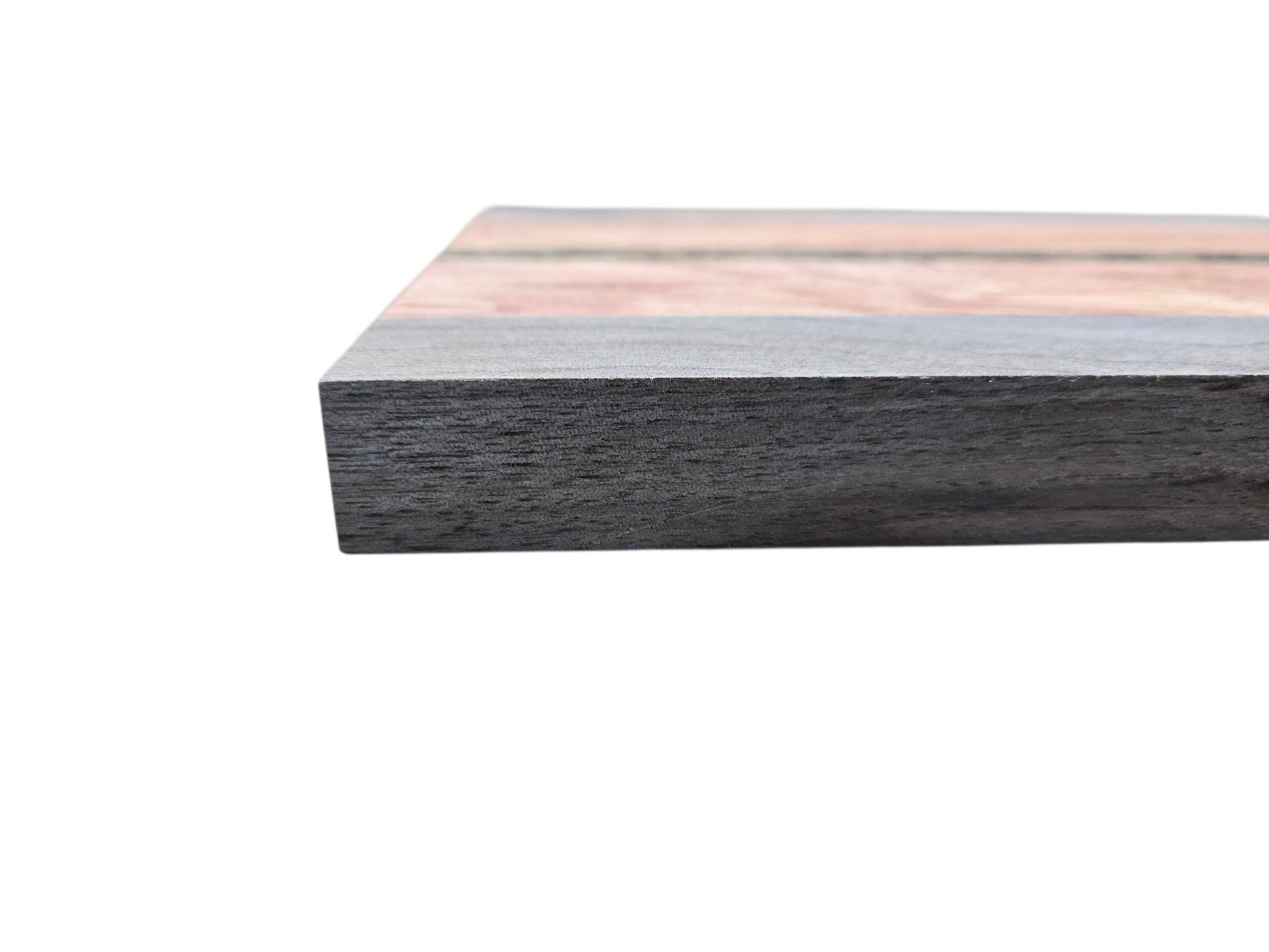 Walnut pink ivory and black palmwood cheese board displayed in kitchen setting